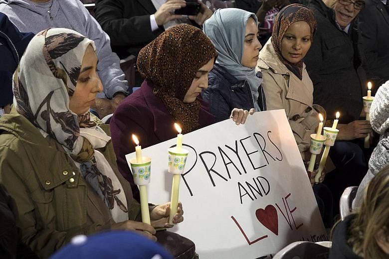Muslim mourners during a candlelight vigil for the mass shooting victims in San Bernardino, California. The massacre left 14 people dead and 21 wounded. The motives for the rampage remain unclear.