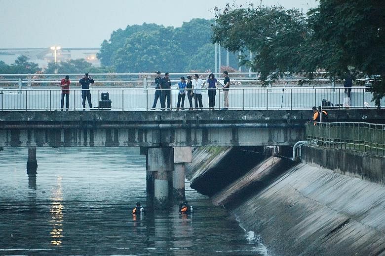 Police searching in East Coast for evidence during investigations. An area outside the National Sailing Centre was cordoned off as well for the search, which lasted about five hours. Divers were also seen scouring the waters. Iskandar Rahmat had clai