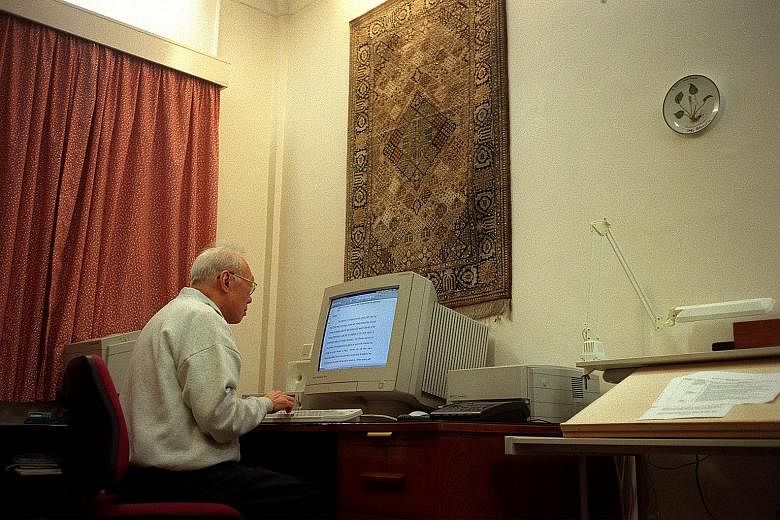 Mr Lee Kuan Yew knew about calls from the public to turn his house at 38, Oxley Road (above) into a museum and a memorial, but was adamant that it be demolished after his death. (Left) The late Mr Lee at work in the house.