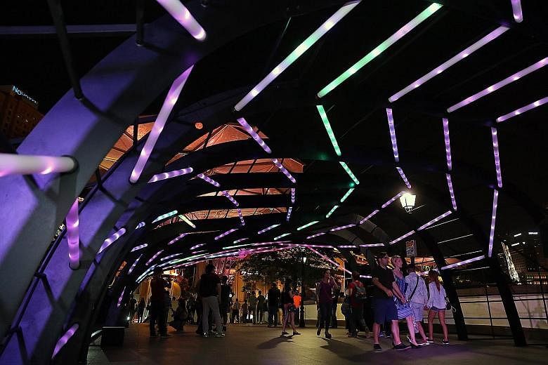 Ribbon-like acrylic tubes lit up the Read Bridge in Clarke Quay last night, for an interactive art installation called RIBbon. The installation is made up of 224 Philips acrylic light tubes and is shaped like a giant ribcage. The colours and intensit