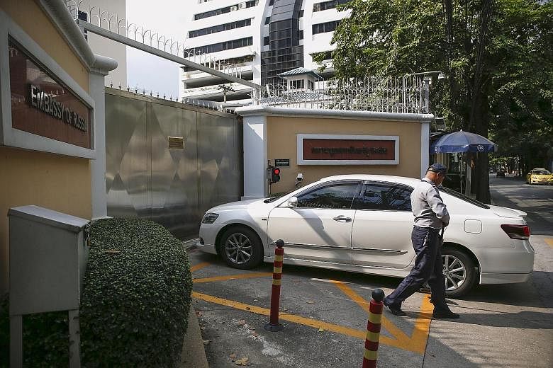 A security guard checking a car entering the Russian Embassy in Bangkok yesterday. The circular from Thailand's Special Branch to its offices said Moscow's Federal Security Service had told Thai police that 10 Syrian militants from ISIS had entered 