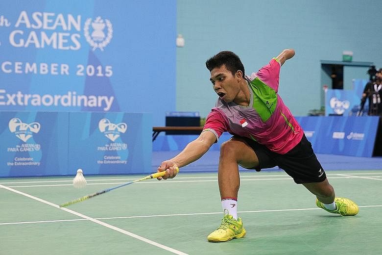 Indonesia's Suryo Nugroho (right) beat Malaysia's Mohamad Faris Ahmad Azri in the men's team badminton final yesterday. Having lost his left arm at 12, he went on to become his country's top para-shuttler.