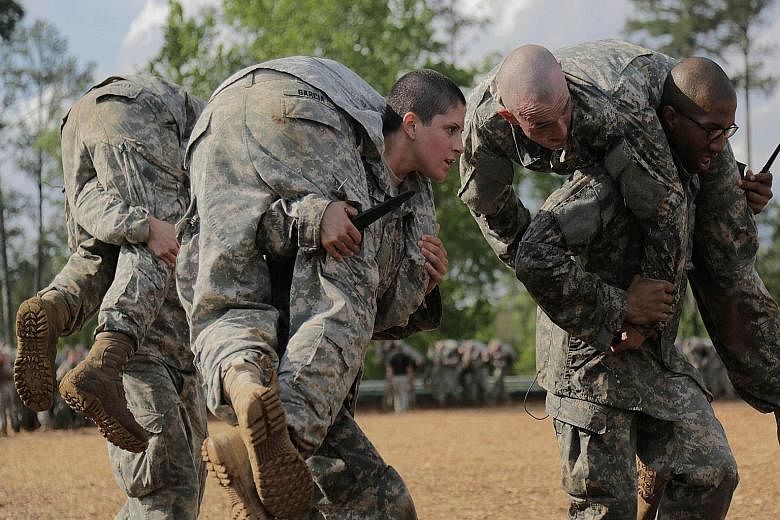 First Lieutenant Kirsten Griest and fellow soldiers in combat training during the Army Ranger course at Fort Benning, Georgia. Women have chafed under combat restrictions, which allowed them to serve in combat zones but prevented them from holding co