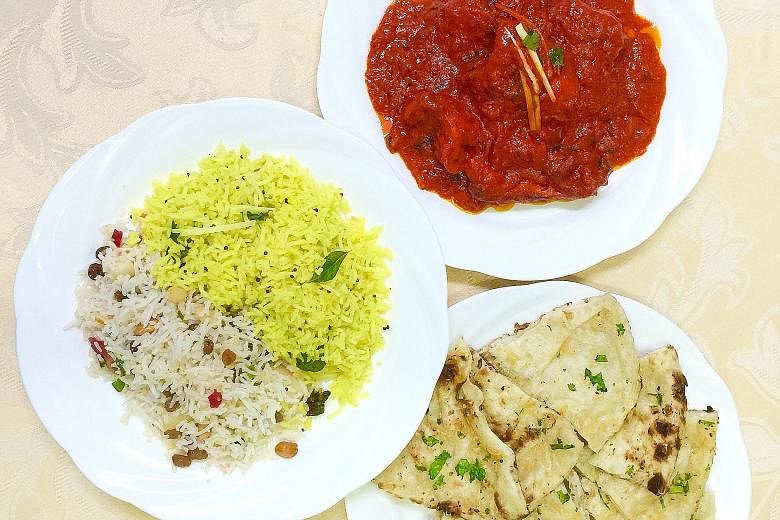 Clockwise from top: chicken tikka masala, garlic naan, lemon rice and Cashmiri rice.