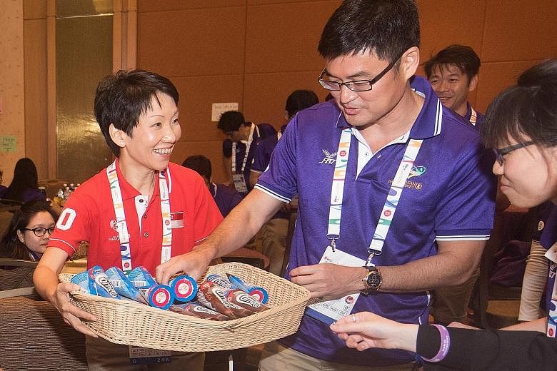 She did not have KitKats to give to volunteers taking a break but Minister for Culture, Community and Youth Grace Fu had a basket full of ice cream to share at Marina Bay Sands. She visited volunteers yesterday - which was also International Voluntee