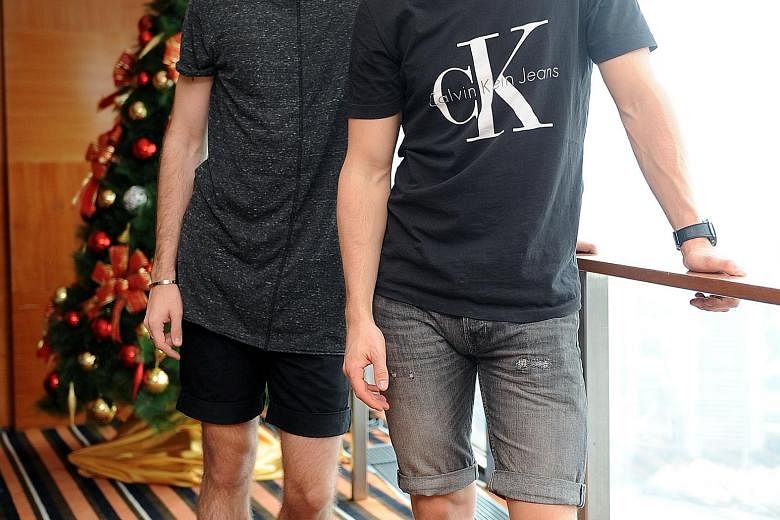 YouTubers Alfie Deyes (above left) and Marcus Butler (right); and with their fans at the Swissotel The Stamford hotel.