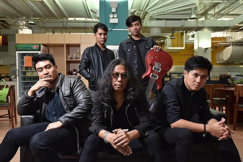 Veteran rock singer Hanafie Warren (middle, foreground) and his bandmates (clockwise from far left) bass player Caspar Francis, guitarists Iliya Zaki and Melvin Cyril, and his son, keyboardist Fifi Leong.