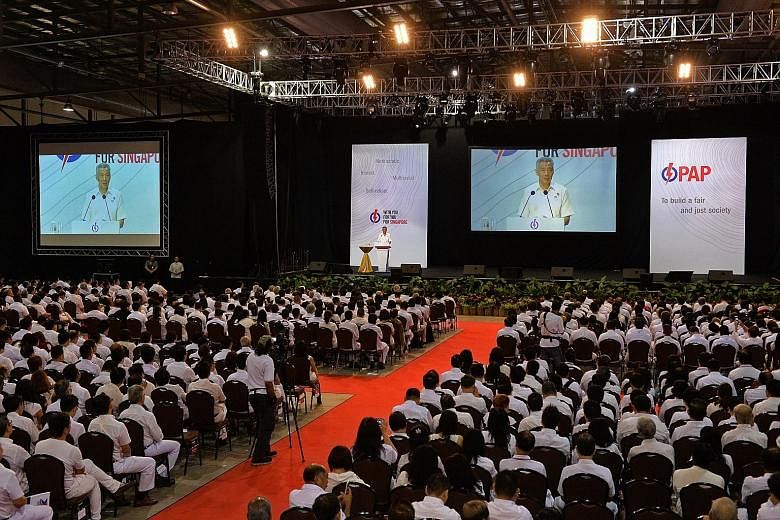 PM Lee Hsien Loong speaking at the PAP convention yesterday. What will strengthen Singapore further is "to have Singaporeans doing things together, for one another", he said.