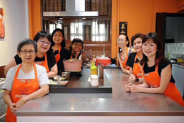 Food Playground co-founder Lena Tan (far right) with staff (from left) Wong Ah Mee, 68, Lesley Lim, 47, Helen Teo, 55, Lydia Soh, 43, Caryn Oh, 34, and Tan Heng, 62.