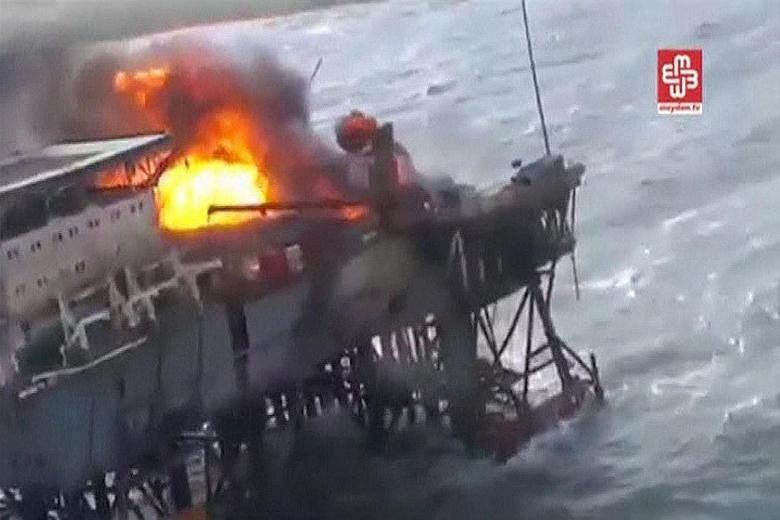 An image from video footage showing the oil platform on fire in the Caspian Sea. Azerbaijan President Ilham Aliyev has announced the creation of a government commission to coordinate the handling of the incident.