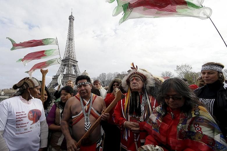 Indigenous leaders sailing on the Seine on Sunday near the Eiffel Tower during a gathering demanding what they call true climate solutions. Several developing countries want an accounting system that differentiates them from rich nations, saying they
