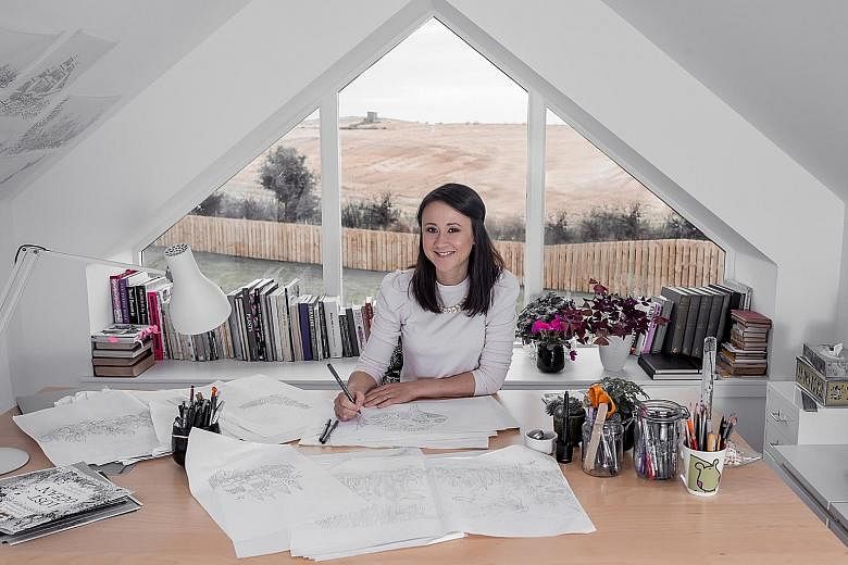 Illustrator Johanna Basford working at her home studio in Aberdeen, Scotland (left). Her latest book features her signature intricate drawings (below centre) of amazing detail that need fine-tipped pencils to colour them in.