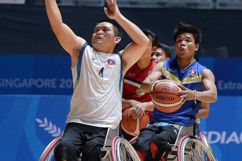 Chanthavong Vingthong (left), captain of the Laos wheelchair basketball team, used his financial knowledge to fund their trip to the Asean Para Games.