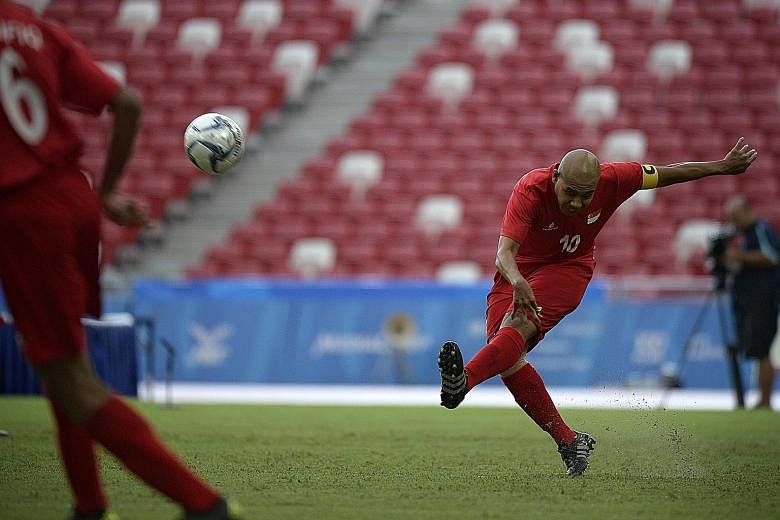 Khairul Anwar trying a long-range shot against Malaysia yesterday. The Singapore captain netted once in the 4-2 win, taking his tally to five goals in the tournament.