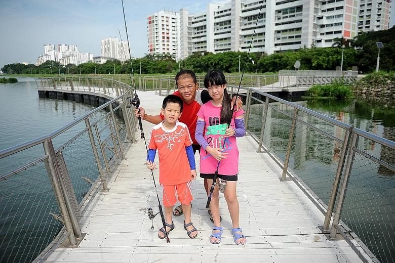 Mr Yong Choon Wee with his children Anders and Angel on an outing at Pandan Reservoir two weeks ago. Mr Yong, who was diagnosed with pulmonary arterial hypertension seven years ago and was given 10 years to live, went on a fishing trip to the Souther
