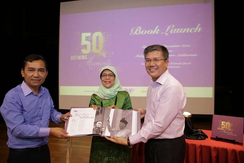 (From left) Berita Harian editor Mohd Saat Abdul Rahman, Speaker of Parliament Halimah Yacob and AMP chairman Azmoon Ahmad at the launch of the book, 50 Defining Moments For The Malay/Muslim Community, at the Malay Heritage Centre yesterday.