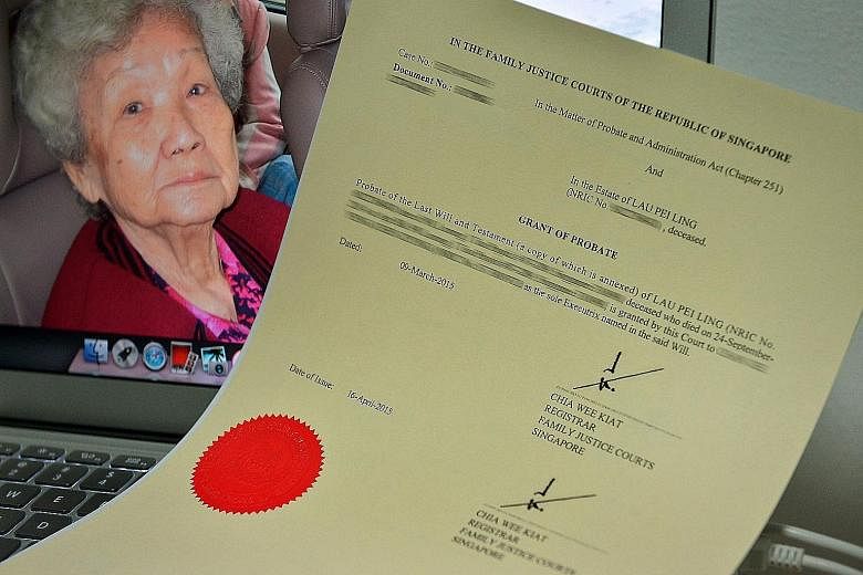 The grant of probate made in 1978 in which the three Chan sisters' grandfather left his Toa Payoh flat to Madam Lau Pei Ling (in background) after his death. Madam Lau died last October aged 93.