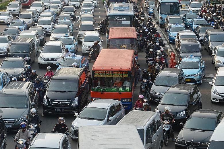Uber yesterday said it has received the green light to operate in Jakarta (left), after giving assurances that it would comply with local tax rules and other requirements.