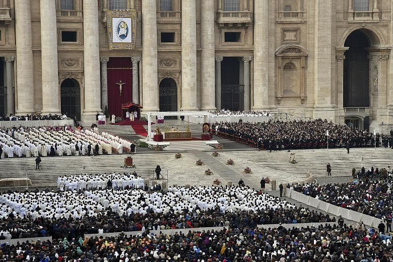 Pope Francis saying Mass in St Peter's Square yesterday, the start of the Roman Catholic Church's Jubilee Year of Mercy. The first pilgrims had gathered in the square before dawn to witness the event, held under unprecedented security in the wake of 
