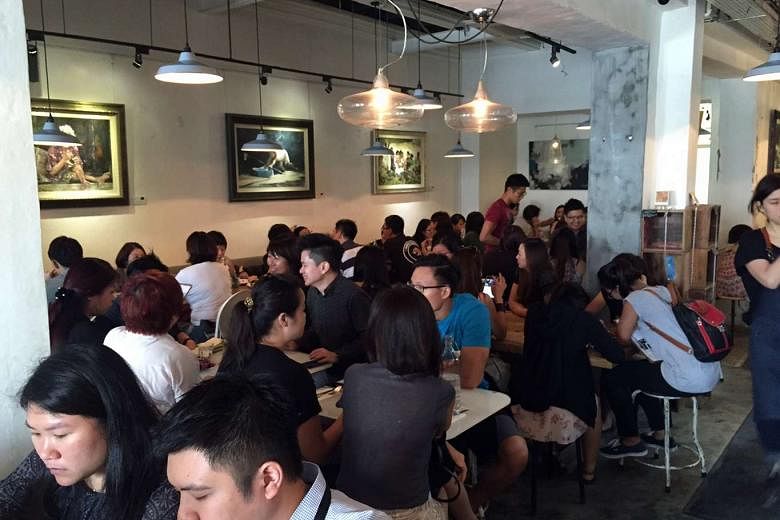 Strangers' Reunion (above) was packed at lunchtime yesterday after the cafe posted on Facebook that they would be open on Tuesdays to help raise funds for their cancerstricken head chef Sebastian Tan.