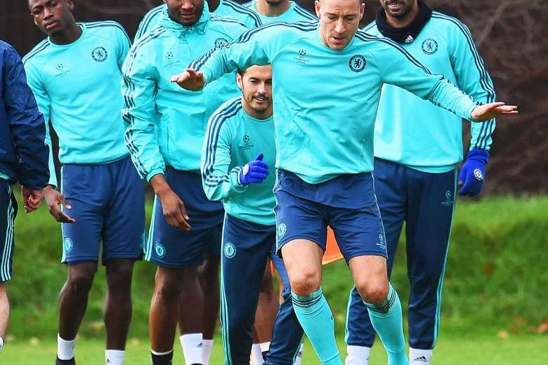 John Terry (front) returning from an ankle injury and training with the Chelsea squad ahead of their Champions League clash with Porto at Stamford Bridge. 