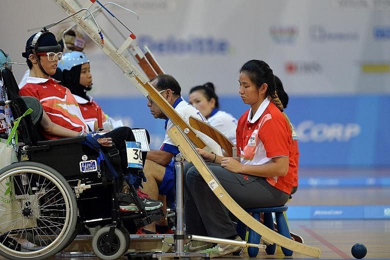 Toh Sze Ning (front) and Nurulasyiqah Mohammad Taha had to settle for silver after losing to Thailand's Tanimpat Visaratanunta and Ekkarat Chaemchoi in the boccia BC3 mixed pair category yesterday.