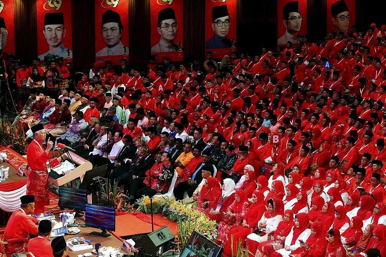 Prime Minister Najib Razak, the Umno president, delivering his keynote address at the 69th Umno General Assembly in Kuala Lumpur yesterday.