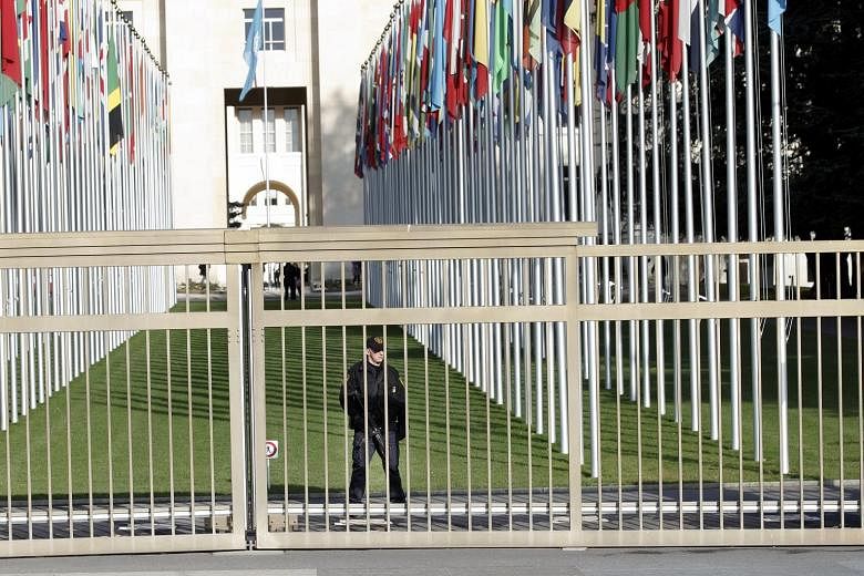 An armed security officer at the European headquarters of the United Nations in Geneva. The complex was evacuated on Wednesday night as security personnel conducted office-to-office searches.