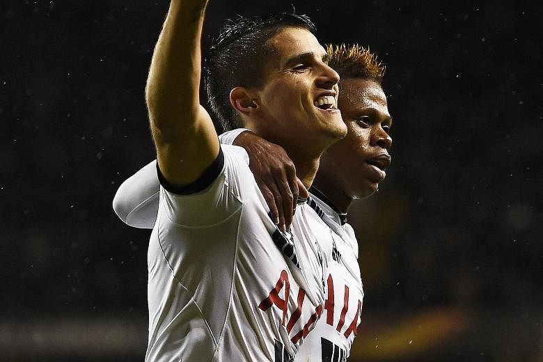 Erik Lamela (left) is congratulated by Clinton Njie after completing his hat-trick in Tottenham's 4-1 victory over Monaco in their Europa League Group J game at White Hart Lane on Thursday. All three of his goals came in the first half.