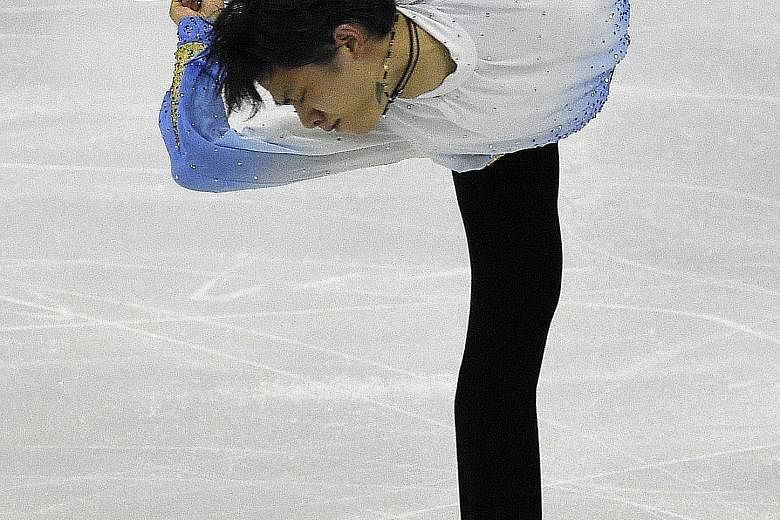 Yuzuru Hanyu competing and achieving a world record score during the men's short programme of the ISU Grand Prix of Figure Skating Final 2015 in Barcelona.