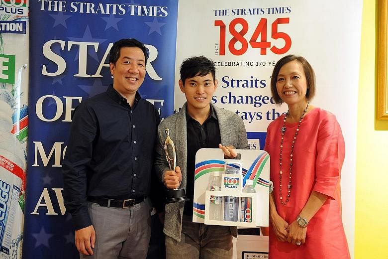 Tan Xiang Tian with Marc Lim, sports editor of The Straits Times, and Jennifer See, general manager of F&N. Tan is The Straits Times' Star of the Month for November for winning gold at the World Championships.