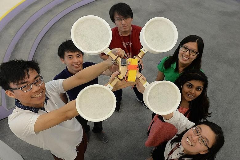 Inspired by the haze, SUTD students (from left) Chew Cheng York, Khaw Jien Yi, Goh Xin Ro, Tan Yu Da, Aastha Chouhan and Tan Yee Ying came up with Cleansecopter, a drone that sucks up haze particles.