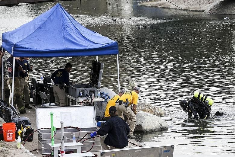 FBI divers searching for evidence in Seccombe Lake, which is near the scene of last week's massacre in San Bernardino.