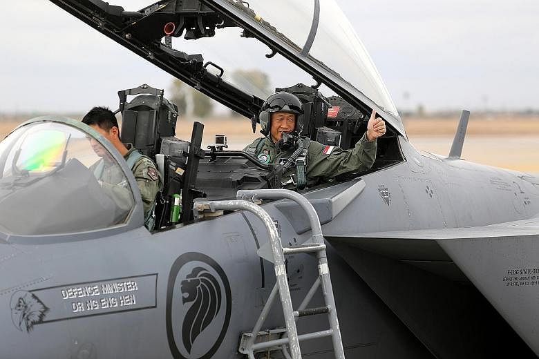 Defence Minister Ng Eng Hen preparing for take-off in an F-15SG piloted by Major Shewen Goh in Arizona, US. Dr Ng was there to observe how Singapore's air and ground troops worked together.