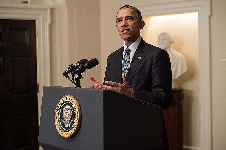 US President Barack Obama speaking at the White House after the climate pact was reached. While he hailed the deal, the Republican presidential candidates' silence highlighted the political divide on the issue.