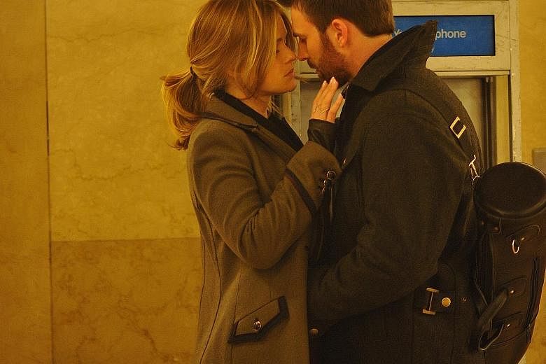 Brooke (Alice Eve) and Nick (Chris Evans, both above) meet by chance in New York City's Grand Central Station in Before We Go.