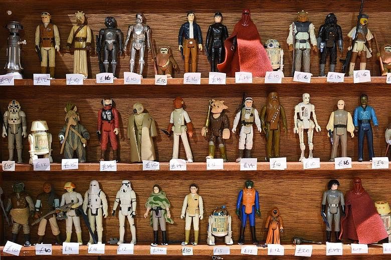 (Clockwise from far left) Star Wars action figures on sale in Manchester, United Kingdom, pet leashes at a Los Angeles store and neckties at a stall in an unofficial Star Wars convention held earlier this month in northern England. Sales of merchandi