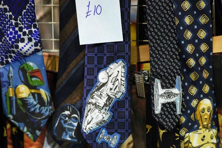 (Clockwise from far left) Star Wars action figures on sale in Manchester, United Kingdom, pet leashes at a Los Angeles store and neckties at a stall in an unofficial Star Wars convention held earlier this month in northern England. Sales of merchandi