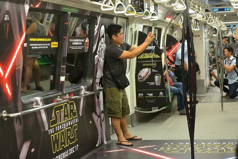 They may not travel at light speed, but commuters can now ride to an MRT station far, far away as Star Wars fever comes to Singapore's trains. From now until Dec 31, carriages on two SMRT trains on the North-South and East-West lines will feature mov