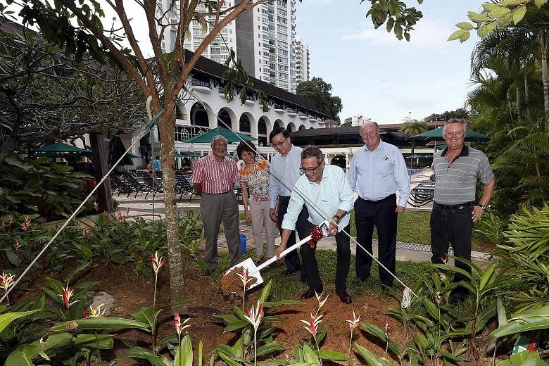 Tanglin Club president Robert Wiener planting a tree on Monday to mark the club's 150th anniversary, watched by (from left) Mr Zoeb Sadiq, the sports and recreation convenor, committee member Ho Chee Lin, vice-president Eugene Lim, honorary treasurer