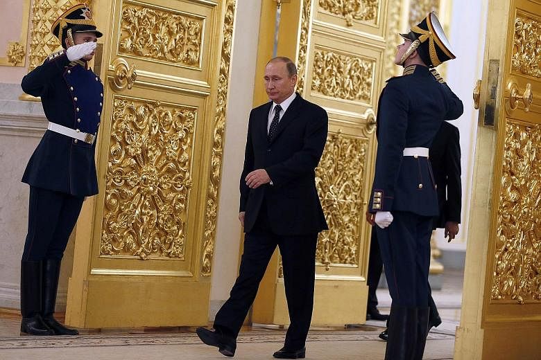 Video footage shows that when Mr Putin walks, his left arm swings normally but his right arm barely moves.