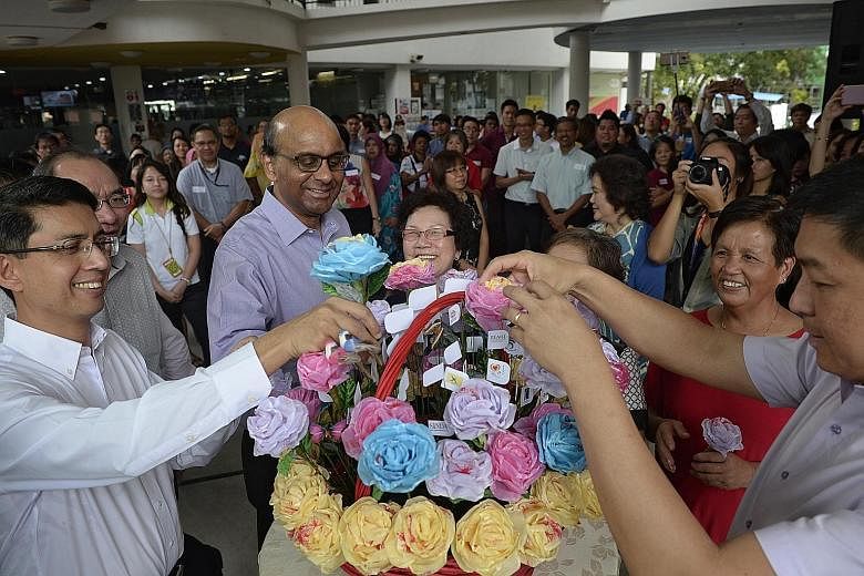 Deputy PM Tharman Shanmugaratnam at yesterday's opening of the Taman Jurong SSO, with Minister of Social and Family Development Tan Chuan-Jin (far right) and Parliamentary Secretary at the Ministry of Education and Ministry of Social and Family Devel