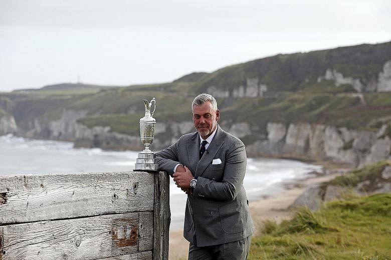 Ulsterman Darren Clarke, who won the 2011 British Open, posing with the Claret Jug in October. The 47-year-old says he is relishing the prospect of pitting his skills against Jordan Spieth at the Singapore Open next month.