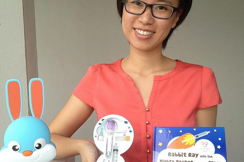 Rabbit Ray, a product of JoyTingle, a social enterprise firm started by Esther Wang (left), teaches kids from ages four to eight about various medical procedures, including intravenous drip and vaccinations.