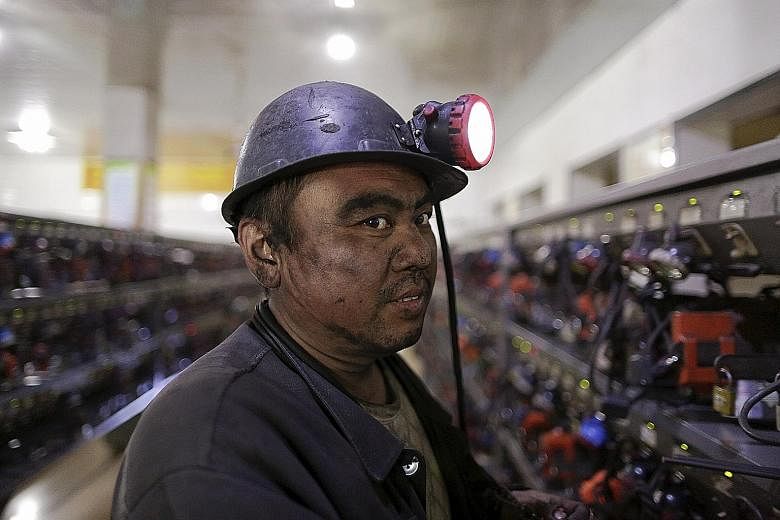 A worker at a Longmay mine in Heilongjiang. The Longmay Group is the biggest coal company in north-eastern China. It announced in September that it planned to lay off 100,000 workers.