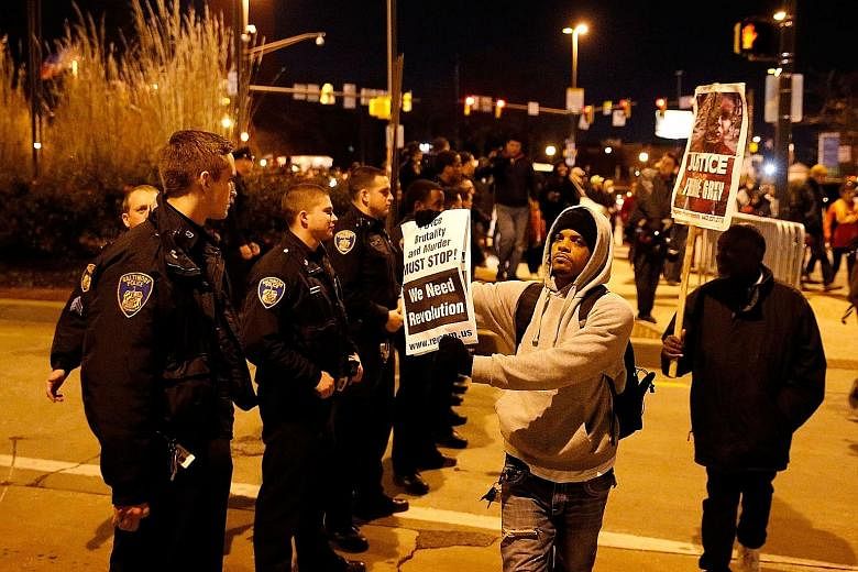 Protesters marching through the streets of Baltimore after a mistrial was declared in the trial of police officer William Porter. It was the first of six trials of police officers involved in the death of Freddie Gray.