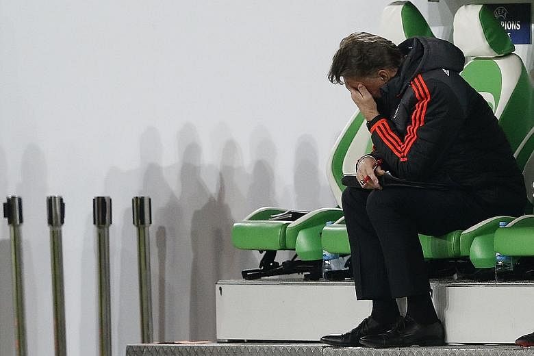Manchester United manager Louis van Gaal looking dejected after the 2-3 loss to Wolfsburg in their Champions League group match.
