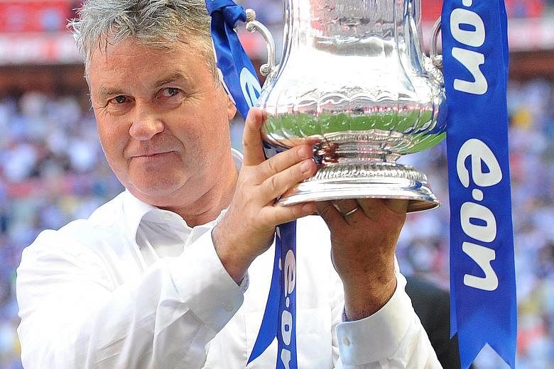 Guus Hiddink with the FA Cup in 2009 after Chelsea beat Everton 2-1 at Wembley.