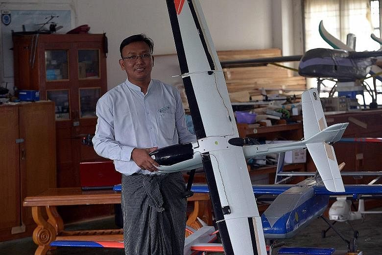 Mr Thae Maung Maung, head of the department for Unmanned Aerial Vehicles, with one of his self-made unmanned aerial vehicles at the Myanmar Aerospace Engineering University in Meiktila, in the Mandalay region in central Myanmar.