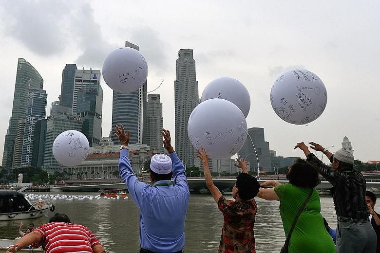 Eighty senior citizens launched what they hoped would be spheres of influence into Marina Bay yesterday. The beneficiaries from the Peace-Connect Seniors Activity Centre and O'Joy Care Services penned their hopes for 2016 on giant balls, then threw t